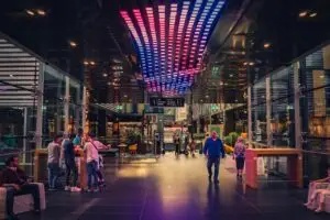 Shopping center interior featuring dynamic LED lighting on the ceiling, creating a vibrant and engaging atmosphere