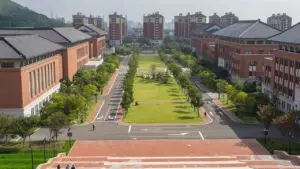 Overview of a university campus with modern buildings and green spaces, representing energy-efficient LED lighting strategies