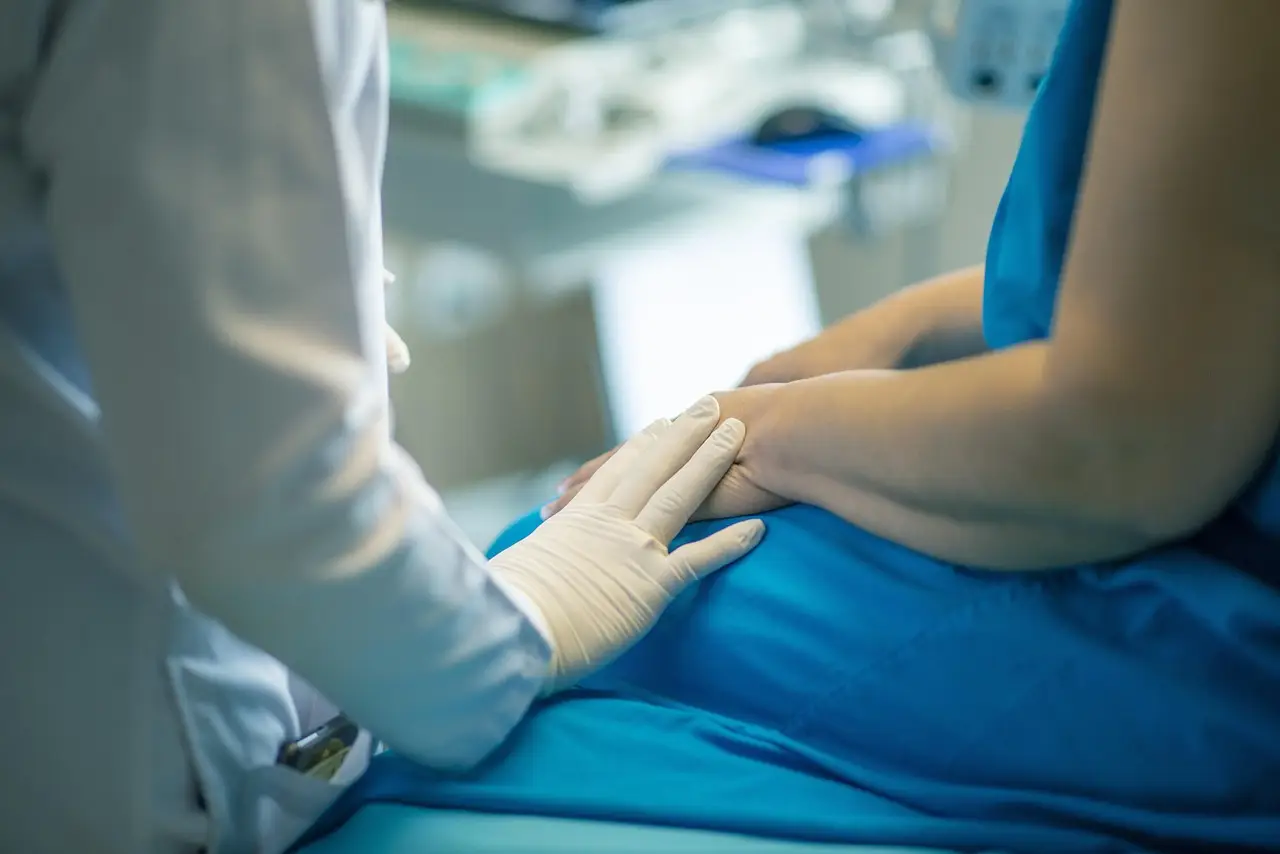 Healthcare professional comforting a patient, symbolizing the importance of LED lighting in improving patient care and well-being in hospitals